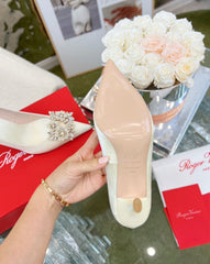 EFFLORESCENCE POINTED-TOE PUMPS IN WHITE SATIN WITH CRYSTAL BUCKLE