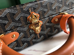 GRAND HÔTEL TRUNK BAG 24 IN BLACK GOYARDINE CANVAS AND TAN CALFSKIN