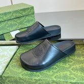 INTERLOCKING G MULE IN BLACK CALFSKIN