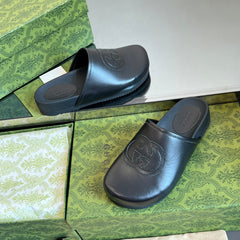 INTERLOCKING G MULE IN BLACK CALFSKIN