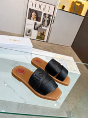 WOODY MULE IN BLACK LAMBSKIN WITH EMBROIDERED LOGO