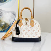 ALMA BB 25 IN WHITE MONOGRAM DUNE CANVAS GOLD HARDWARE