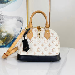 ALMA BB 25 IN WHITE MONOGRAM DUNE CANVAS GOLD HARDWARE