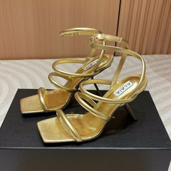 ALAIA THREE-STRAPS HIGH HEEL SANDALS IN GOLDEN PATENT LAMBSKIN