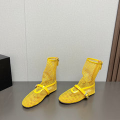 ALAIA SHORT BOOTS IN LEMON YELLOW MESH FISHNET