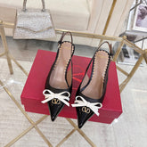 GARAVANI POINTED SLINGBACK PUMPS IN BLACK CALFSKIN