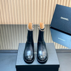 CHANEL 25S SHORT BOOTS WITH CHAIN IN BLACK CALFSKIN