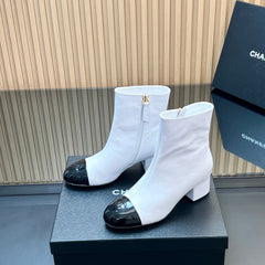 CHANEL 25S BOOTS WITH PATENT TOE CAP 50MM IN WHITE AND BLACK CALFSKIN