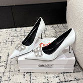 POINTED HIGH PUMPS IN WHITE PATENT CALFSKIN WITH CRYSTAL BUCKLE