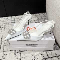 POINTED HIGH SLINGBACK IN WHITE PATENT CALFSKIN WITH CRYSTAL BUCKLE