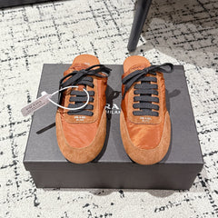 PRADA 25S DEXUN MULE IN BURNT ORANGE SUEDE LEATHER