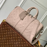 KEEPALL BANDOULIÈRE 34 BAG IN LIGHT BROWN MONOGRAM TAURILLON CALFSKIN