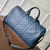 KEEPALL BANDOULIÈRE 50 IN DARK BLUE MONOGRAM SHADOW EMBOSSED CALFSKIN