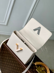 TWIST SLIM 19 IN LIGHT PINK TAURILLON CALFSKIN GOLD HARDWARE