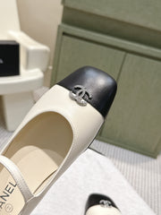 CHANEL 25S MARY JANE FLATS IN IVORY LAMBSKIN WITH BLACK CAP TOE SILVER HARDWARE