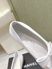 CHANEL 25S MARY JANE BALLET FLATS IN WHITE LAMBSKIN BLACK PATENT CAP TOE WITH BOW