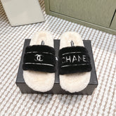 CHANEL 25S FLUFFY SLIDERS IN BEIGE AND BLACK