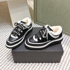 CHANEL 25S THICK-SOLE SNEAKERS IN BLACK AND WHITE CALFSKIN WITH FUR LINING