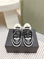 CHANEL 25S THICK-SOLE SNEAKERS IN BLACK AND WHITE CALFSKIN WITH FUR LINING