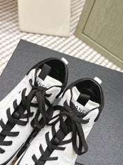 CHANEL 25S HIGH-TOP SNEAKERS IN BLACK AND WHITE CALFSKIN AND SUEDE