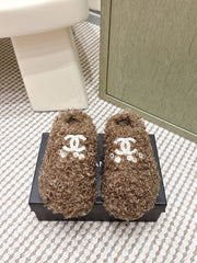 CHANEL 25S CLASSIC FURRY SLIDES IN BROWN WITH DOUBLE C LOGO