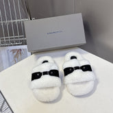 BALENCIAGA 25S SLIPPERS IN BLACK SUEDE AND WHITE WOOL