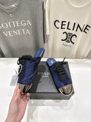 PRADA 25S MULES IN DARK BLUE WITH METAL TOECAP