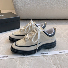 CHANEL 25S TRAINERS 40MM IN WHITE AND BLACK CALFSKIN