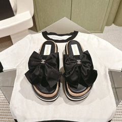 CC SLIPPERS WITH SILK BOW IN BLACK COWHIDE