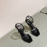 YSL 25S HIGH-HEEL SANDALS 100 MM IN BLACK SATIN WITH YSL LOGO HEEL DESIGN IN GOLD