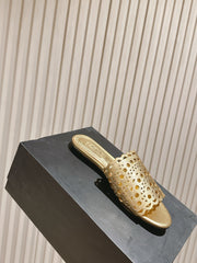 ALAIA PERFORATED SLIDE SANDALS 25S IN LIGHT GOLD LAMBSKIN