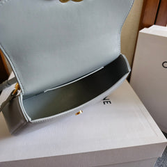 TEEN LOLA TRIOMPHE BAG 20 IN COOL GRAY BLUE CALFSKIN