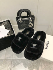 THICK-SOLED SLIPPER IN BLACK LAMB FUR