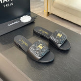 FLAT MULE IN BLACK LAMBSKIN