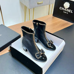CHANEL 25S HEELED CHAIN BOOTS WITH BOW IN BLACK CALFSKIN GOLD HARDWRE