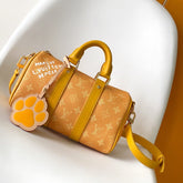 KEEPALL BANDOULIÈRE 25 IN ORANGE MONOGRAM HERITAGE CANVAS