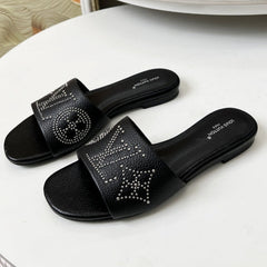 FLAT SLIDE IN BLACK LAMBSKIN WITH RHINSTONES