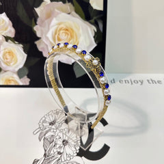 HAIRBAND EMBELLISHED DIAMOND AND PEARL IN GOLD METAL 376822