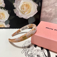 HEADBAND WITH GARNITURE PRINT IN TIGER EYE ORANGE SILK 432822