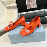 SQUARE TOE PUMPS IN INTERNATIONAL ORANGE GLOSSY CALFSKIN ATTACHED BOW
