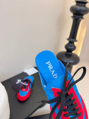 SNEAKER MULES IN BLUE NYLON AND RED SUEDE