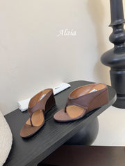 ALAIA WEDGE THONG SANDALS 25S IN BROWN SATIN
