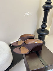 ALAIA WEDGE THONG SANDALS 25S IN BROWN SATIN