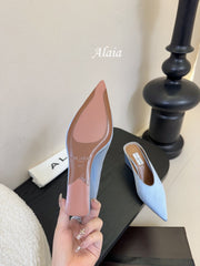 ALAIA HIGH MULES 25S IN LIGHT BLUE SATIN