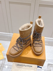 ASPEN PLATFORM ANKLE BOOT IN CIDER BROWN MONOGRAM DEBOSSED SUEDE AND SHEARLING