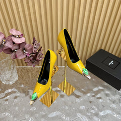 GREEN GEM-STUDDED HIGH PUMPS IN YELLOW PATENT CALFSKIN
