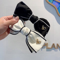 BOW HAIRPIN IN BLACK AND WHITE TRIM COTTON 406022