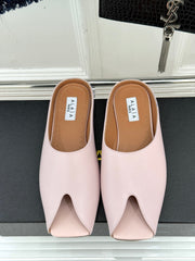 ALAIA FLAT MULE IN LIGHT PINK LAMBSKIN