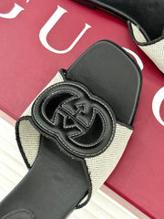 SLIDE SANDALS IN BLACK AND WHITE CALFSKIN