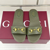 SLIDE SANDALS IN MOSS GREEN CALFSKIN WITH GOLD HARDWARE